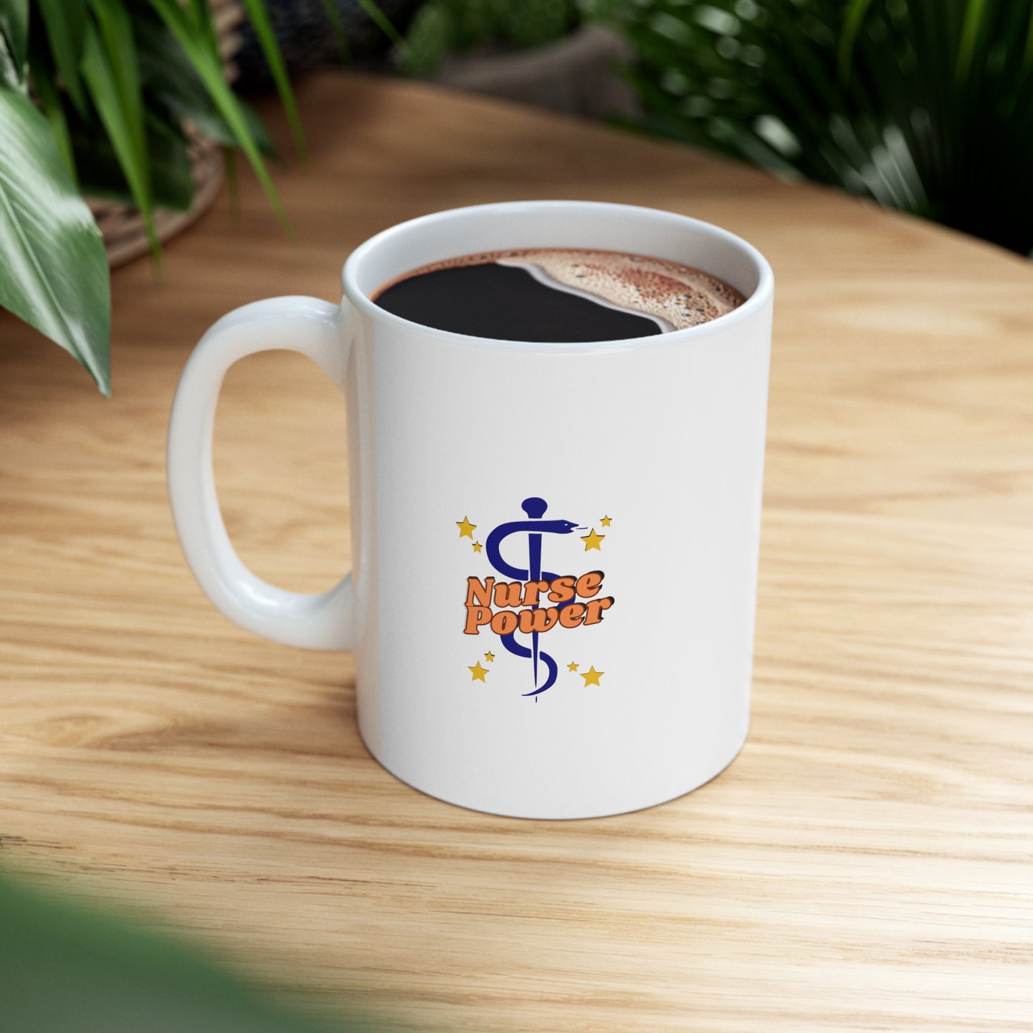 White 11 oz. mug with Orange Nurse Power logo on one side and text on the other side that says "Tireless and kind hearts- Nurses mend more than just wounds. Healers of the soul."